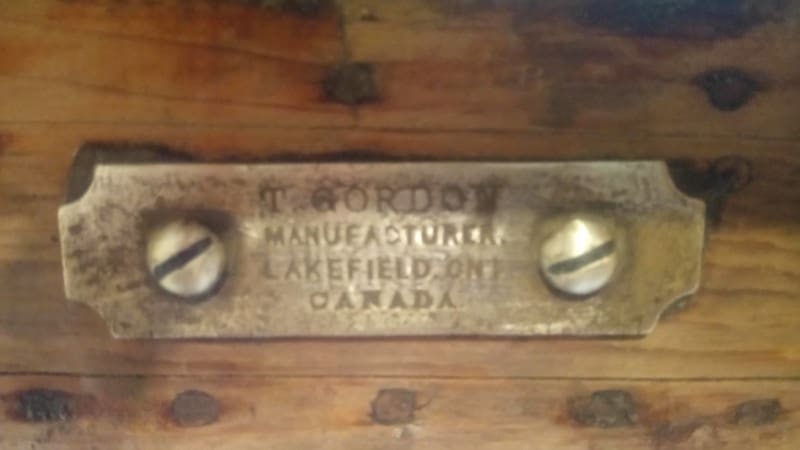 Brass plate with engraved text, two screws.