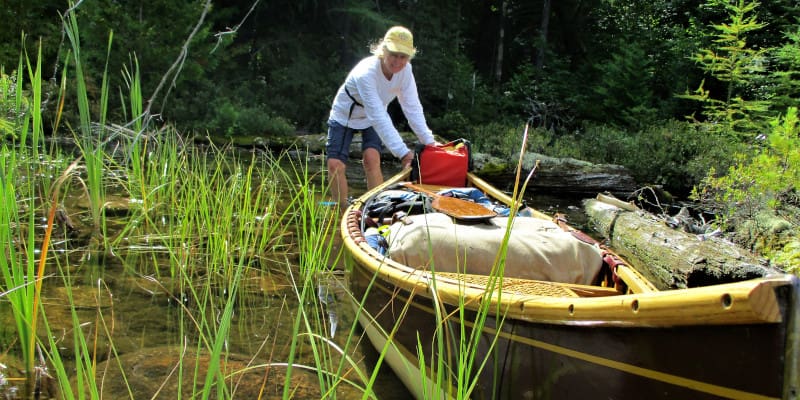 Canoe on a forested waterway