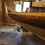 Workshop with partially completed wooden boat