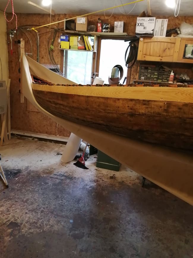 Workshop with partially completed wooden boat