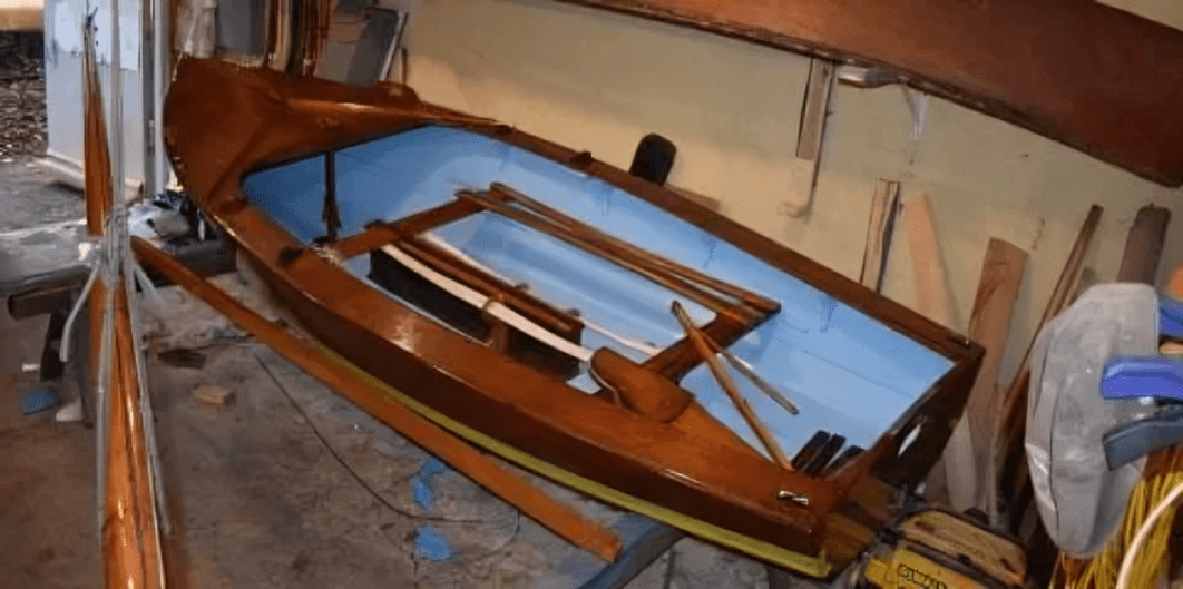 Wooden boat under construction in workshop