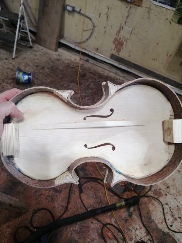 Violin body under construction in workshop